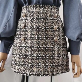 Jupe de tailleur en tweed avec boutons dorés sur le devant