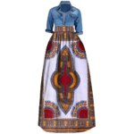 Photo d'une jupe wax longue blanche avec imprimé géométrique rouge et doré avec une chemise bleue en jean